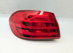 BMW 4 F32 2014r PRZEDLIFT LAMPA LEWY TYŁ Z BŁOTNIKA USA 7296099  