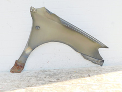 TOYOTA COROLLA E12 2.0 BŁOTNIK LEWY PRZÓD 1C3